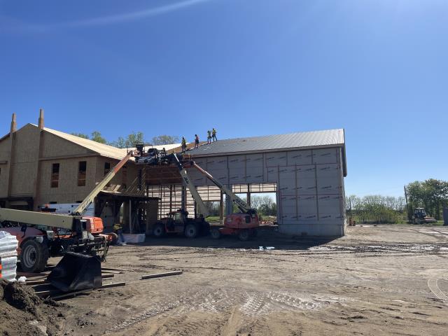 Horst Construction wanted a roof for their new office and showroom that went beyond the look and performance of traditional barn steel. They chose SS550 hidden fastener SnapLock panels to achieve a clean, modern finish that matched the quality of their new building.

The challenge came with the scale of the project: the roof required panels over 30 feet long, which would normally be difficult to transport without risking shipping damage.

Our solution was to bring the roll former directly to the jobsite in Horst Construction’s yard. By roll-forming the 24-gauge SnapLock panels right on the roof deck, we eliminated shipping risks, ensured perfect panel lengths, and allowed for a faster, more efficient installation.

The result is a seamless, high-performance standing seam roof that elevates the company’s new office and showroom while showcasing the precision and durability that Country Towne delivers.