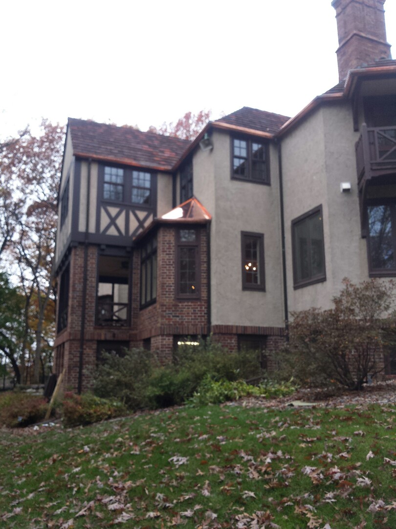 Hopkins, MN - Fabricated and installed custom copper flanged 1/2 gutters, standing seam roof and pounded down flat seam roof Hopkins, MN - Fabricated and installed custom copper flanged 1/2 gutters, standing seam roof and pounded down flat seam roof