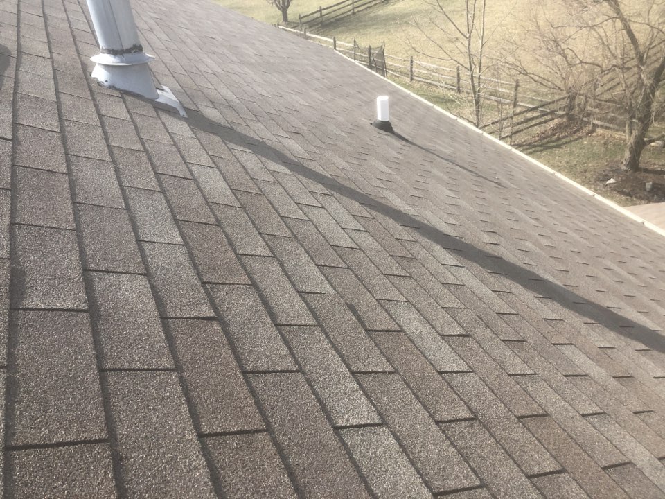 Shingle roof inspection for wind damage