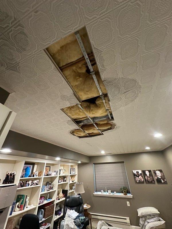 # Remodel Completion Summary

Completed comprehensive remodel work addressing water damage and plumbing infrastructure issues. Removed damaged decorative ceiling tiles and replaced deteriorated copper piping showing extensive blue-green corrosion and oxidation. Repaired ceiling structure, replaced compromised insulation materials, and restored interior finishes to original condition. All work performed in accordance with the scope outlined in the original estimate.

# Detailed Work Performed

## Plumbing System Repairs

Accessed attic crawl space to assess and remediate corroded copper piping system. Removed deteriorated copper pipes exhibiting significant oxidation and blue-green corrosion, particularly at elbow joints and connection points. Replaced compromised brass fittings and valves. Installed new copper piping with proper foam pipe insulation throughout affected areas. Verified all connections for proper seal and tested system for leaks upon completion.

## Structural and Insula