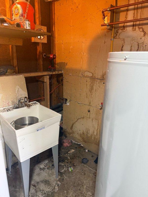 Replaced failed natural gas direct vent water heater with new unit. Installed new copper supply lines, gas connections, and verified proper venting through exterior wall. System tested and operational with no leaks detected.