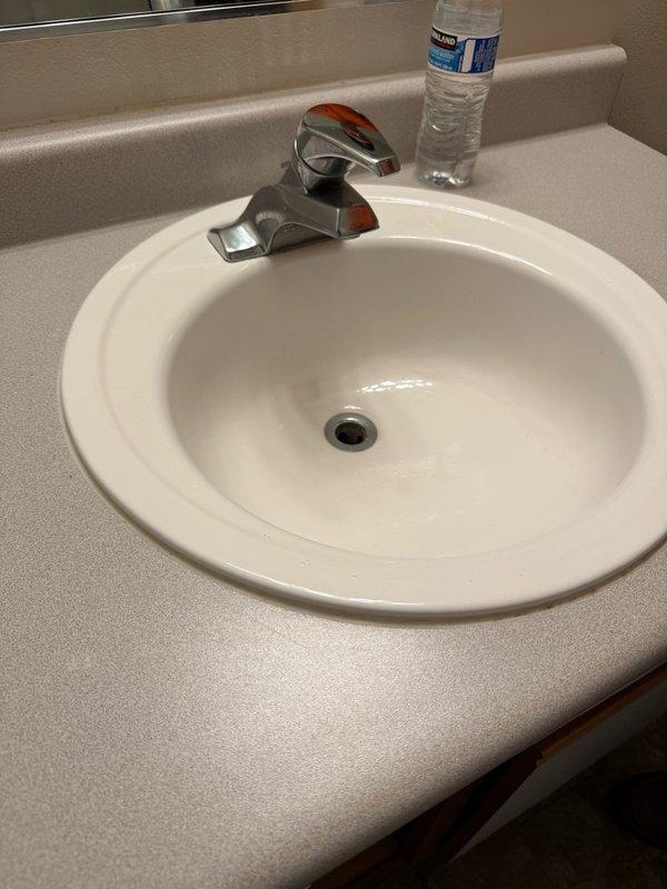 Completed installation of kitchen and lavatory faucets in residential unit in preparation for upcoming inspection. Installed chrome single-handle lavatory faucet with proper supply line connections to existing plumbing infrastructure. Installed kitchen faucet with appropriate water supply connections, ensuring all fixtures were properly secured, tested for leaks, and verified full operational functionality before completion.