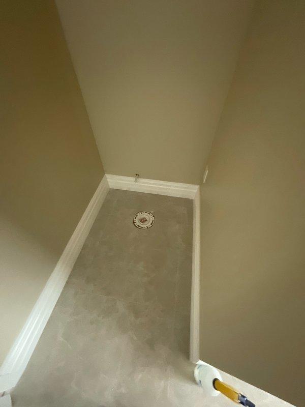 Conducted complimentary estimate for electrical trim-out work on residential bathroom and utility closet where rough-in electrical was previously completed by another contractor. Documented existing conditions including partially tiled bathroom with exposed electrical junction boxes, incomplete wall finishes, and utility closet with floor drain requiring finish electrical installation of fixtures, outlets, switches, and lighting to complete the project that has been in progress for approximately eighteen months.