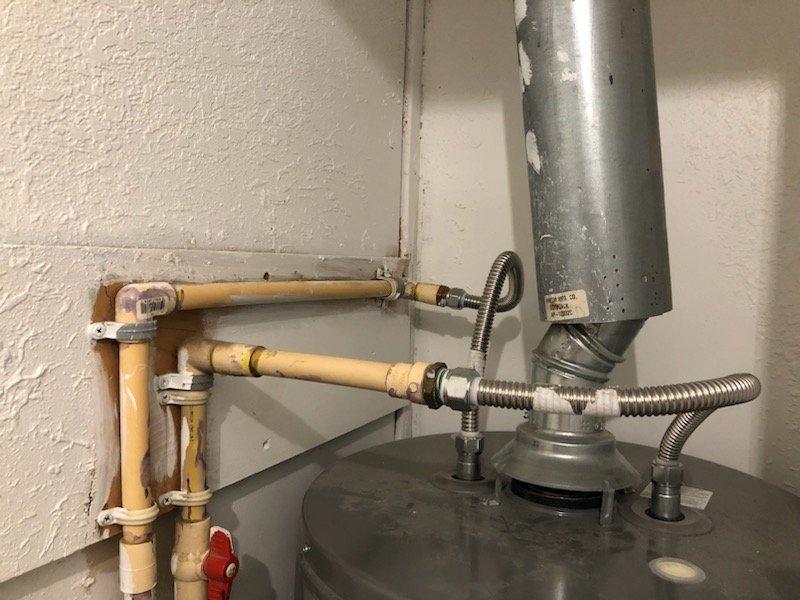 Responded to manufactured home for propane water heater replacement estimate. Upon inspection, confirmed existing water heater installation does not meet manufactured home specifications. Evaluated current venting system including Queen Manufacturing NS-1800CC roof jack assembly and determined replacement required to meet code compliance. Assessed existing copper plumbing configuration, shutoff valves, and flexible connectors at water heater base. Documented equipment specifications and venting requirements. Provided estimate for proper manufactured home-rated propane water heater installation including compliant venting components and necessary roof jack replacement.
