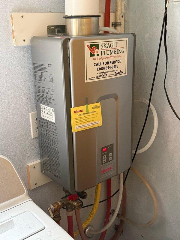 Performed maintenance service on Rinnai tankless water heater unit per estimate specifications. Inspected control panel functionality and verified proper temperature display reading at 120-125°F. Applied company service label to unit for maintenance tracking purposes and ensured product registration documentation remained visible for customer reference.