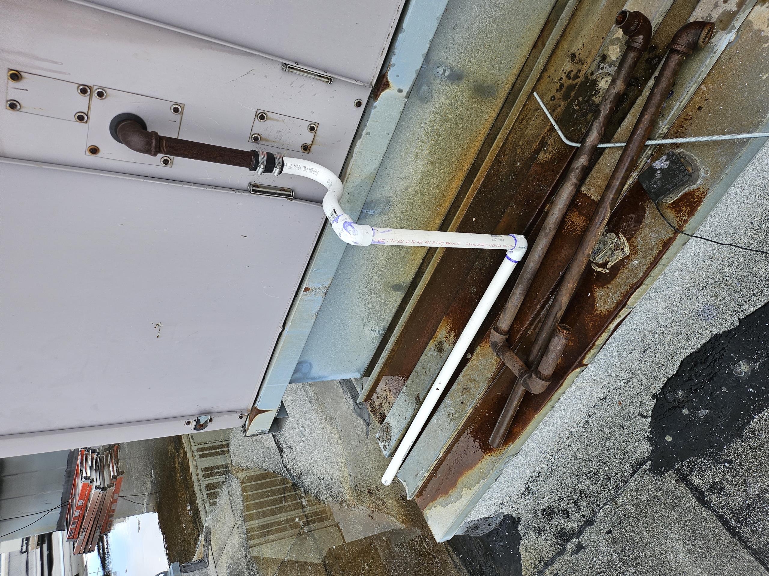Return to replace the broken drain line for the second floor unit, cut out the old steel line and installed a new 1-in PVC trap. Installed a couple of PVC 90° elbows and piping to allow the water to run away from the unit. Primed the drain line and confirm that everything is draining properly.
While on site I also checked out rooftop unit number two because it had tripped overnight, the machine has been reset and is operating. We will order tattletales and install them on below and high pressure circuit to help us determine what is tripping the machine.