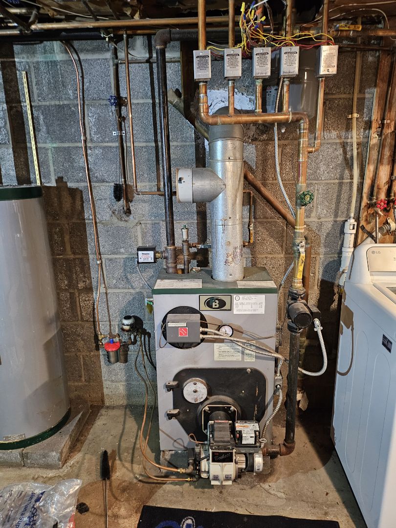 Performing a maintenance on an Peerless oil fired hot water boiler for a customer in West Milford New Jersey today