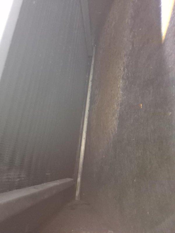 Responded to no cooling complaint with reported musty odor resembling rotten water or possible mold. Upon inspection, found severely clogged air filter with heavy accumulation of dust, debris, and particulate matter restricting airflow throughout the system. Interior ductwork and air handler components showed significant dust buildup and contamination. Documented conditions with photographs and recommended immediate filter replacement and duct system evaluation for potential mold remediation and venting replacement to restore proper system operation and indoor air quality.