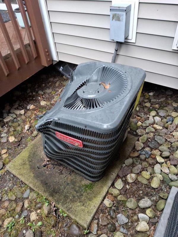 Completed full system replacement due to condenser damage from falling ice. Removed existing R410A system and installed new Goodman condenser unit with R454b refrigerant on existing concrete pad. Replaced indoor evaporator coil mounted on furnace to ensure compliance with current code requirements for refrigerant leak detection system. Connected electrical service, refrigerant lines, and condensate drainage. System tested and operational.