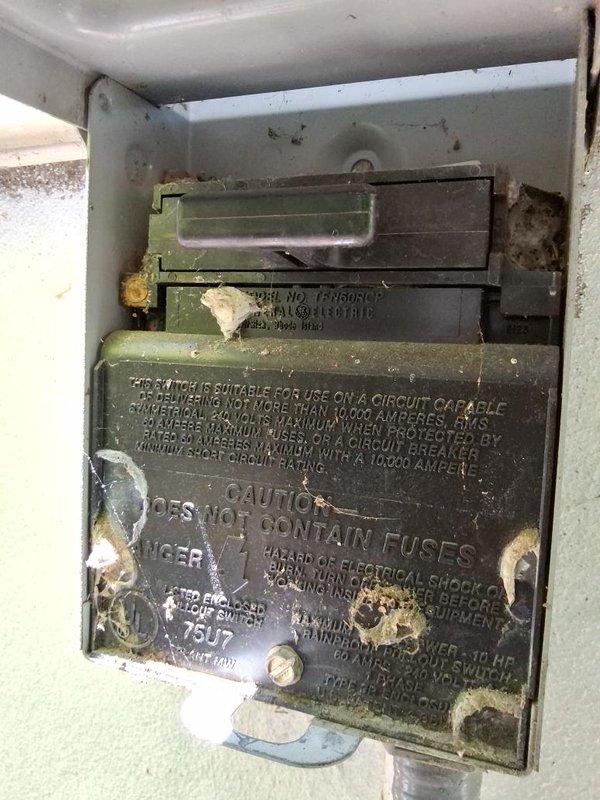 Conducted estimate for residential HVAC system replacement on 15+ year old air conditioning unit with reported refrigerant leak and potential furnace compatibility issues. Inspected outdoor condenser unit showing signs of age and deterioration, evaluated electrical disconnect box exhibiting significant corrosion and wear, and assessed system compatibility requirements. Documented equipment condition through photographs and provided recommendations for complete system replacement to address refrigerant leak concerns and ensure proper AC/furnace compatibility.