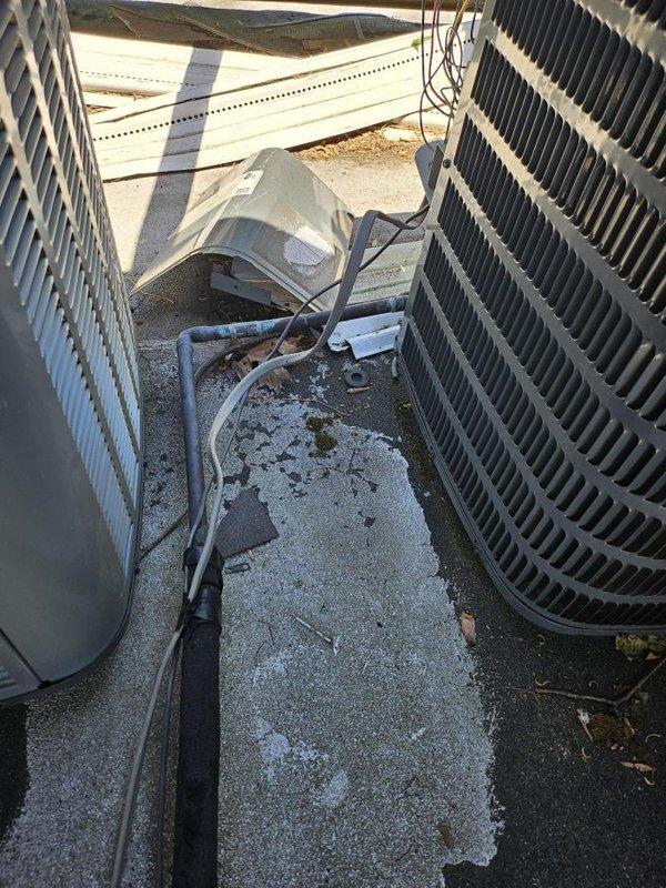# Insurance Repair - Compressor/Condenser Replacement

Completed insurance claim repair involving full compressor and condenser unit replacement on residential split HVAC system. Removed failed compressor and condenser assembly from existing concrete pad installation. Disconnected refrigerant lines, electrical connections, and condensate drainage components from original equipment.

Installed new condenser unit on existing concrete pad in side yard service area. Routed and connected refrigerant line sets between outdoor condenser and indoor air handler. Secured electrical conduit and wiring to new equipment per manufacturer specifications and local electrical code requirements. Connected condensate drain lines and verified proper drainage operation.

Pressure tested refrigerant system for leaks and evacuated lines to manufacturer-recommended vacuum levels. Charged system with appropriate refrigerant type and quantity per unit specifications. Verified all electrical connections secure a
