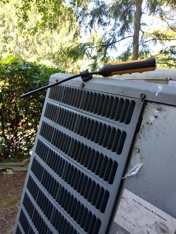 Responded to no cooling call and performed diagnostic evaluation of residential air conditioning system. Connected manifold gauges to service ports and assessed refrigerant pressures on outdoor condensing unit. Unit showed signs of operational issues requiring pressure testing to determine system status. Documented equipment condition and gauge readings with photographs for service records.