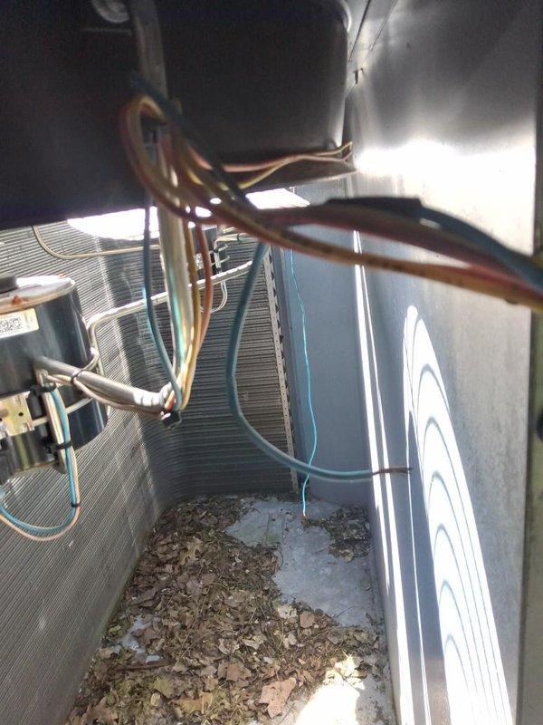 Responded to urgent no cooling call at commercial building. Upon arrival, performed system assessment to identify affected unit among multiple HVAC systems on property. Conducted visual inspection of outdoor condensing unit and associated components, including compressor, condenser coil, refrigerant lines, and electrical connections. Documented equipment conditions with photographs showing copper line sets, condenser coil with aluminum fins, and overall installation configuration. System evaluated for proper operation and potential causes of cooling failure.