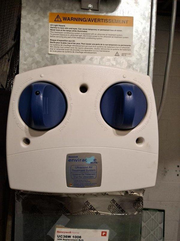 Performed comprehensive leak test on residential AC system including condenser unit, branch box, and two air handler units. Testing revealed significant ice buildup on one air handler, indicating potential refrigerant leak or airflow restriction requiring further diagnosis. Verified proper operation of installed Honeywell enviracaire ELITE ultraviolet air treatment system during inspection.