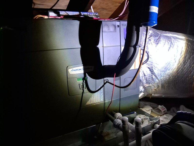 Responded to no cooling complaint on American Standard air handler system. Upon arrival, verified unit was not operating. Performed complete system diagnostic including electrical checks, thermostat verification, and refrigerant level assessment. Inspected air handler unit in basement location and confirmed proper installation of UV air sanitization system. Checked condensate drain lines including blue PVC routing to ensure proper drainage. Verified all electrical connections, wiring, and control circuits. Examined ductwork including insulated supply plenum and flexible return connections for proper airflow. System found to be operating within normal parameters after diagnostic completion.