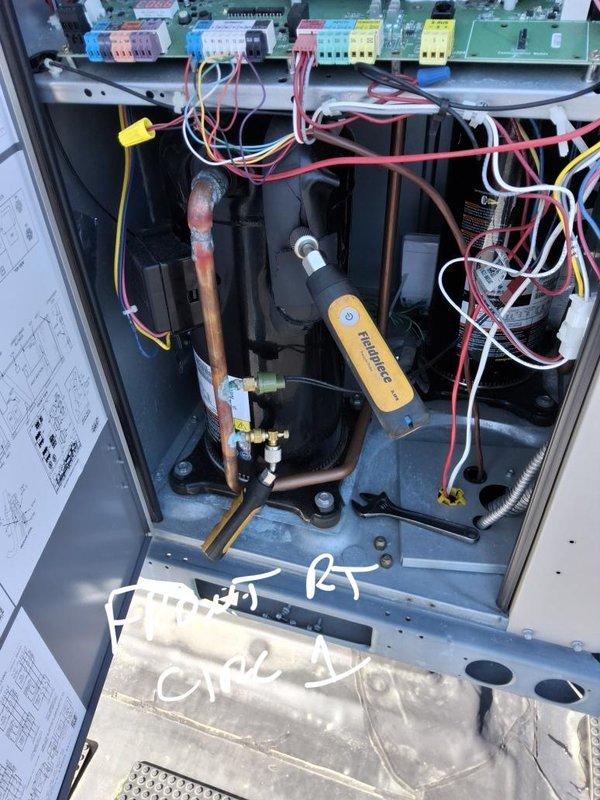 Responded to no cooling call and performed diagnostic evaluation of HVAC system. Upon arrival, accessed unit interior compartment and conducted comprehensive inspection of electrical components, refrigerant lines, and control systems. Verified proper connections at control board terminal blocks and examined capacitors for functionality. Checked thermostat operation on dual Budderfly digital controls, noting temperature differentials between set points and actual readings. Utilized diagnostic testing equipment to assess system performance parameters and documented equipment condition through photographic record for service file.