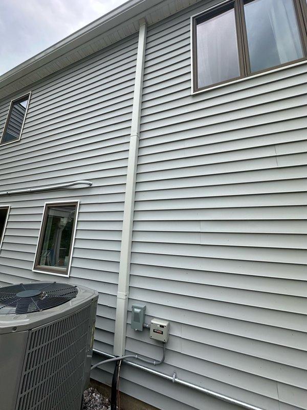 Installed new refrigerant piping from relocated outdoor condensing unit to indoor air handler. Routed copper line set along exterior wall with proper insulation and secured mounting, connected to condenser unit positioned on ground-level pad, and verified system integrity with field measurements upon completion.