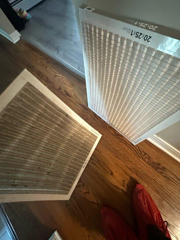 Completed seasonal maintenance on one air conditioning system. Replaced dirty air filter with new 20x25x1 filter to ensure proper airflow and system efficiency. Inspected blower motor assembly and blower wheel, noting dust and debris accumulation on fins and surrounding components typical of normal operation.