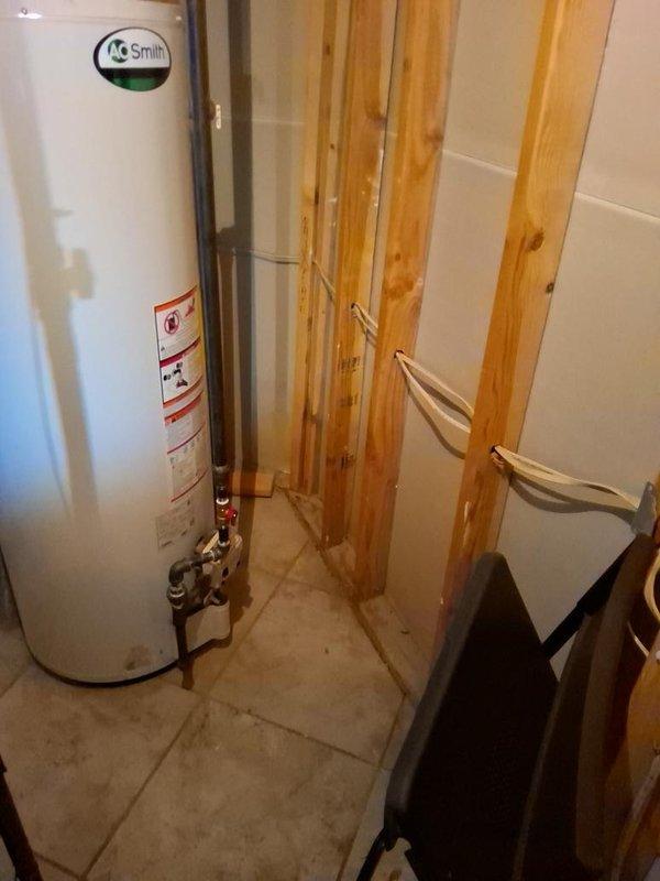 Conducted on-site evaluation for Mitsubishi mini-split installation in basement utility area. Assessed existing mechanical room conditions, photographed installation locations near water heater and HVAC equipment, and documented spatial requirements for indoor and outdoor unit placement. Provided comprehensive estimate for ductless system installation with recommendations for optimal equipment positioning.