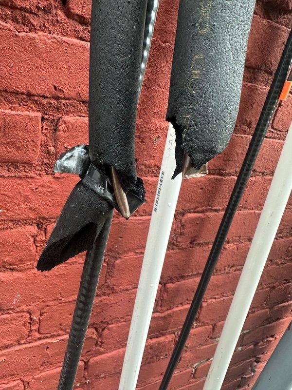 Installed Fujitsu Airstage outdoor condenser units on exterior brick wall for classroom HVAC system. Mounted units with proper brackets, ran refrigerant line sets with foam insulation vertically along wall, and installed electrical conduit with appropriate routing to connect power and controls to the condensers.