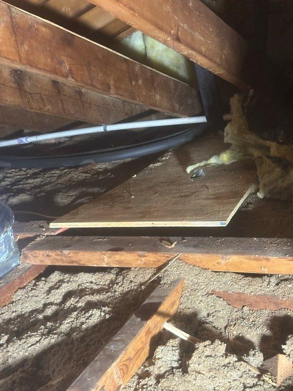 Responded to no cooling call and found ducted air conditioning system with frozen evaporator coil upon arrival. Inspected attic-mounted air handler and confirmed ice buildup on coil and refrigerant lines. Examined outdoor condensing unit and associated refrigerant piping, noting oxidation on copper lines and weathered insulation. Shut down system to allow complete defrost cycle of evaporator coil. Checked airflow at air handler and found restricted airflow due to insufficient return air or dirty filter causing coil temperature to drop below freezing point. Verified refrigerant line insulation integrity on both suction and liquid lines. Allowed adequate time for ice to melt completely before further diagnostics. System requires follow-up service to address underlying cause of freeze condition, which may include checking refrigerant charge levels, verifying proper airflow across evaporator coil, inspecting blower motor operation, and replacing air filter if restricted.