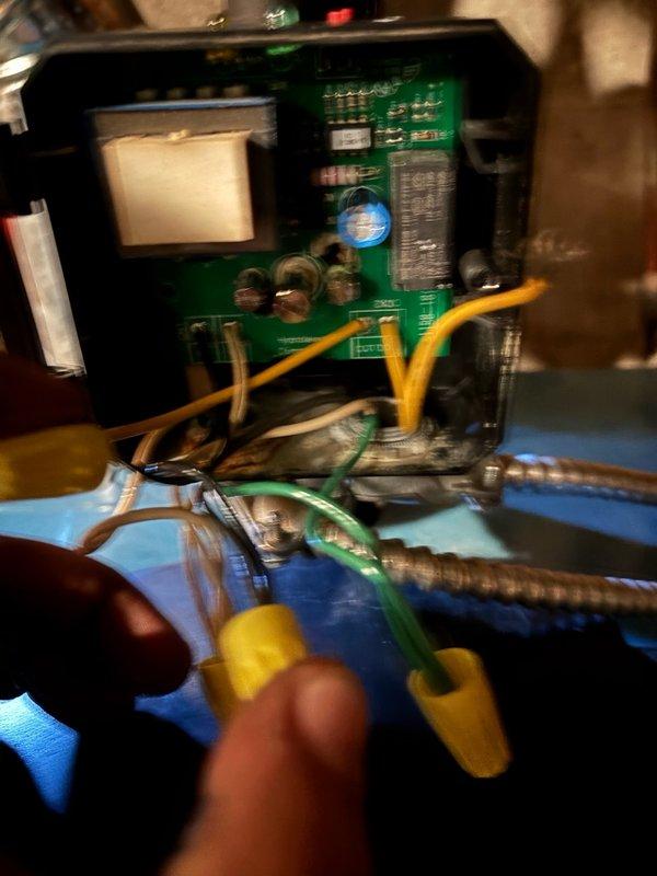 Responded to no cooling call and performed diagnostic testing on HVAC system control board. Upon inspection, identified failed expansion tank requiring replacement. Removed existing expansion tank and installed new unit. Verified all electrical connections to control board, including relay components and capacitor. Tested wire connections with multimeter to ensure proper voltage and continuity throughout system. Secured all wire nuts and verified proper connection of yellow, green, white, and brown wiring to circuit board terminals. Confirmed flexible metal conduit connections were secure and properly routed. Cycled system through complete operational test to verify cooling function restored and all components operating within normal parameters.