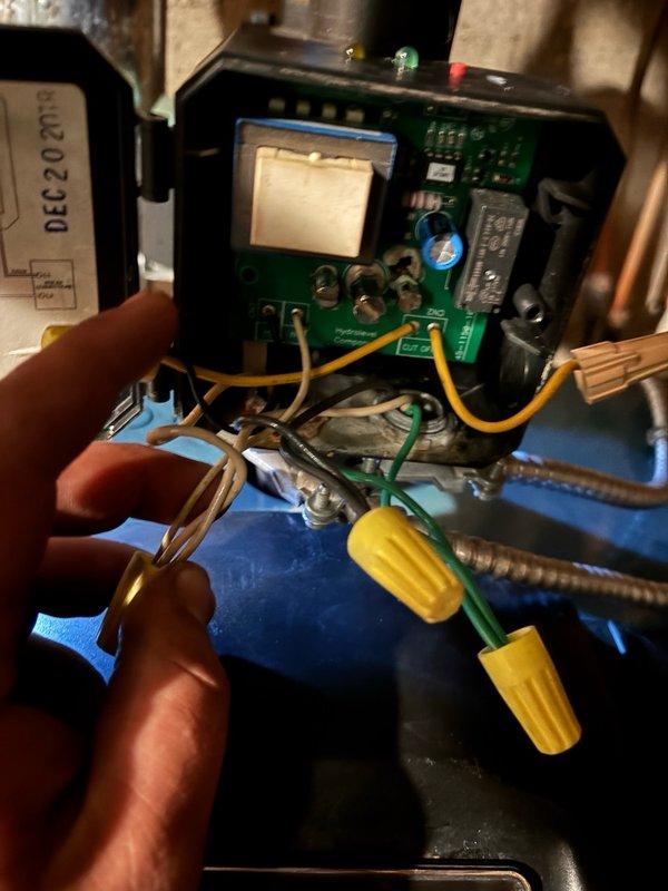 Responded to no cooling call and performed diagnostic testing on HVAC system control board. Upon inspection, identified failed expansion tank requiring replacement. Removed existing expansion tank and installed new unit. Verified all electrical connections to control board, including relay components and capacitor. Tested wire connections with multimeter to ensure proper voltage and continuity throughout system. Secured all wire nuts and verified proper connection of yellow, green, white, and brown wiring to circuit board terminals. Confirmed flexible metal conduit connections were secure and properly routed. Cycled system through complete operational test to verify cooling function restored and all components operating within normal parameters.