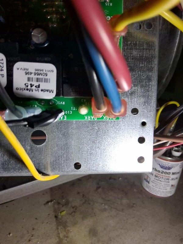 Responded to no cooling complaint with reported loud noise. Upon inspection, found failed compressor motor with seized bearings causing operational failure and excessive noise. Documented existing wiring configuration and control board connections. Diagnosed compressor as non-functional and requiring replacement. Verified 370V run capacitor specifications and existing electrical connections to circuit board. Photographed motor specifications, wiring harness, and control board assembly for replacement reference. Unit remains non-operational pending compressor replacement.