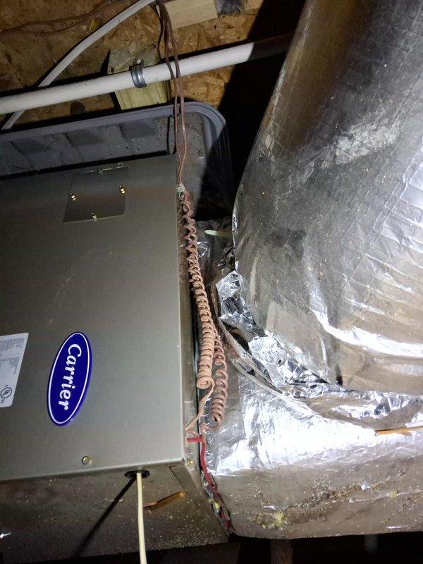 Completed site measurement verification for upcoming HVAC installation. Documented existing Carrier air handler unit in attic space, including current ductwork configuration, refrigerant line routing, and condensate drain piping. Confirmed equipment access clearances and structural mounting points for replacement system.