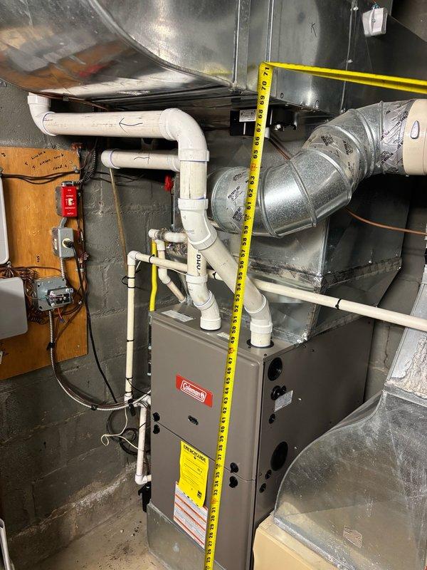 Responded to complaint of insufficient cooling on first floor. Performed system inspection of Coleman furnace and HVAC components in basement. Measured and documented clearances, verified proper installation of condensate drain lines, PVC venting, and ductwork connections. All components found to be properly installed with adequate clearances maintained per manufacturer specifications.