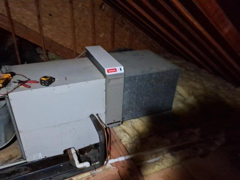 Responded to no cooling call with reported leak. Upon inspection in attic, found air handler with accessible internal components including blower motor assembly and filter. Performed diagnostic testing using multimeter to assess electrical connections and system functionality. Inspected refrigerant lines, ductwork connections, and condensate drainage system. Located source of leak and completed necessary repairs to restore proper operation. Verified system cooling capacity and confirmed all components functioning within normal parameters before departure.