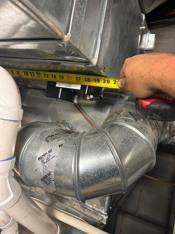 # HVAC System Continuous Operation Issue Resolution

Responded to emergency callback for HVAC unit that would not shut off following previous no-cooling service call. Upon arrival, confirmed unit was running continuously with thermostat unable to cycle system off, resulting in excessive cooling and occupant discomfort.

Performed diagnostic evaluation of thermostat wiring and control circuit. Inspected contactor operation and verified proper voltage at control board. Identified issue with thermostat control signal that developed after previous service visit. 

Traced wiring through plenum and ductwork sections to locate point of failure. Measured and documented ductwork dimensions for access purposes during troubleshooting. Examined flexible duct connections and verified proper installation of all components modified during initial service call.

Located faulty connection in low-voltage control circuit that was preventing proper system shutdown. Corrected wiring issue and restored prop