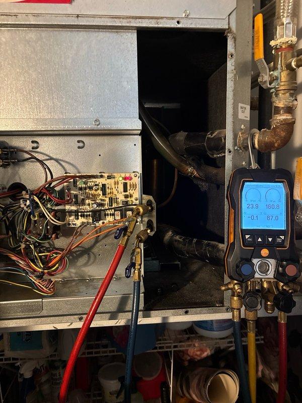 Responded to no cooling complaint and performed diagnostic evaluation of HVAC system. Upon inspection, found system low on refrigerant charge as indicated by manifold gauge readings showing subnormal pressures. Verified compressor operation and checked electrical components at control board. Measured refrigerant charge using calibrated digital scale, which displayed 208 ounces remaining in system. Added refrigerant to manufacturer specifications and confirmed proper system operation with temperature differential readings showing adequate cooling performance restored.