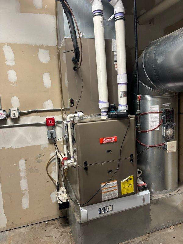Replaced existing 5-ton condenser with new R410A compatible condensing unit. Verified system operation with digital manifold gauges, confirming proper refrigerant pressures and temperatures with superheat and subcooling within manufacturer specifications. System tested and operational with indoor Coleman furnace unit.