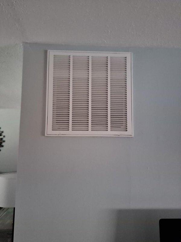 Completed seasonal maintenance on single-zone air conditioning system that had not been serviced in two years. Inspected return air grille and documented existing filter condition, noting dust accumulation on pleated media and rust staining on filter frame assembly, recommending filter replacement to maintain proper airflow and system efficiency.