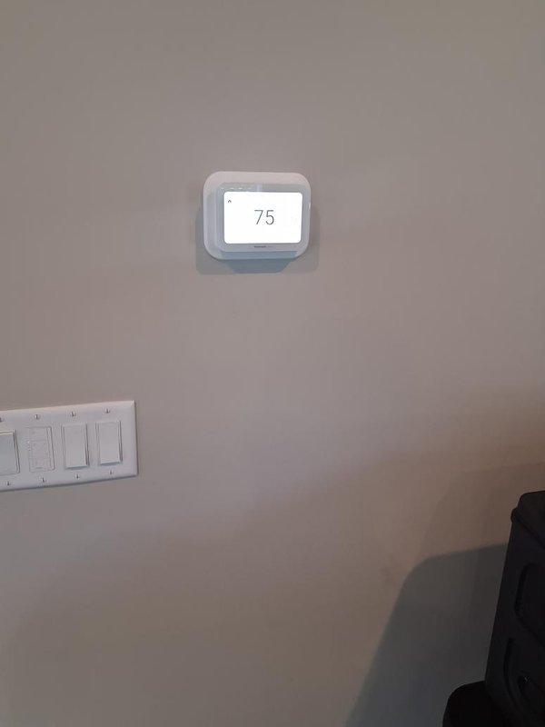 Installed three premium WiFi thermostats throughout the residence, including two units equipped with additional room sensors for enhanced temperature control and one standalone unit. Replaced the existing zone control system with components from inventory and integrated all thermostats into the zoned heating system. Additionally, installed 12 feet of baseboard heating in the porch area, connecting it to the great room thermostat for unified climate control of both spaces.