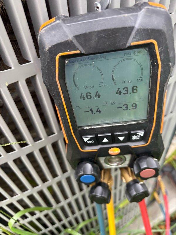 Responded to no cooling complaint with system blowing warm air. Accessed attic-mounted air handler and performed diagnostic testing using digital manifold gauges. Measurements revealed abnormal superheat reading of 46.4°F and subcooling of 43.6°F, indicating refrigerant system issue requiring further evaluation and repair to restore proper cooling operation.