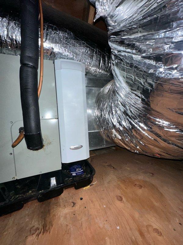 Performed comprehensive leak test on residential split-system Trane air conditioning unit. Inspected outdoor condensing unit and indoor air handler with associated ductwork in attic space. Tested refrigerant lines, connections, and system components for leaks; verified system integrity and proper operation of all equipment.