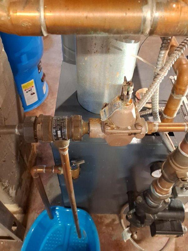 Completed scheduled maintenance and tune-up on residential gas-fired boiler system. Performed comprehensive inspection of all boiler components, burner assembly, heat exchanger, and associated plumbing connections including copper piping, pressure regulating valves, expansion tank, and water filtration system. All components found to be operating within normal parameters with typical aging and patina present on copper fittings. System tested and verified for safe operation.