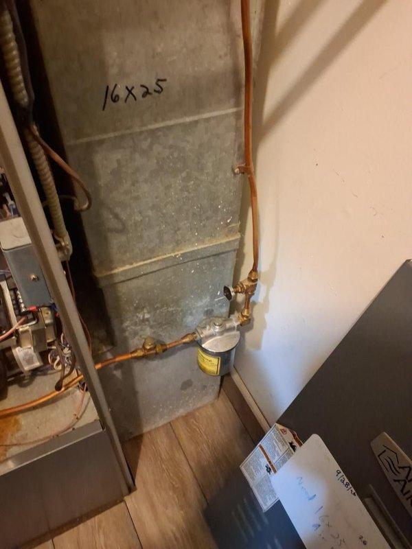 Completed annual maintenance and tune-up on oil-fired furnace system. Performed comprehensive inspection of Beckett burner assembly, cleaned and tested all components, verified proper operation of motor and electrical connections, and checked copper fuel line connections for integrity. Noted rust staining present on interior floor pan indicating previous moisture exposure; verified current system operation is normal with no active leaks detected.