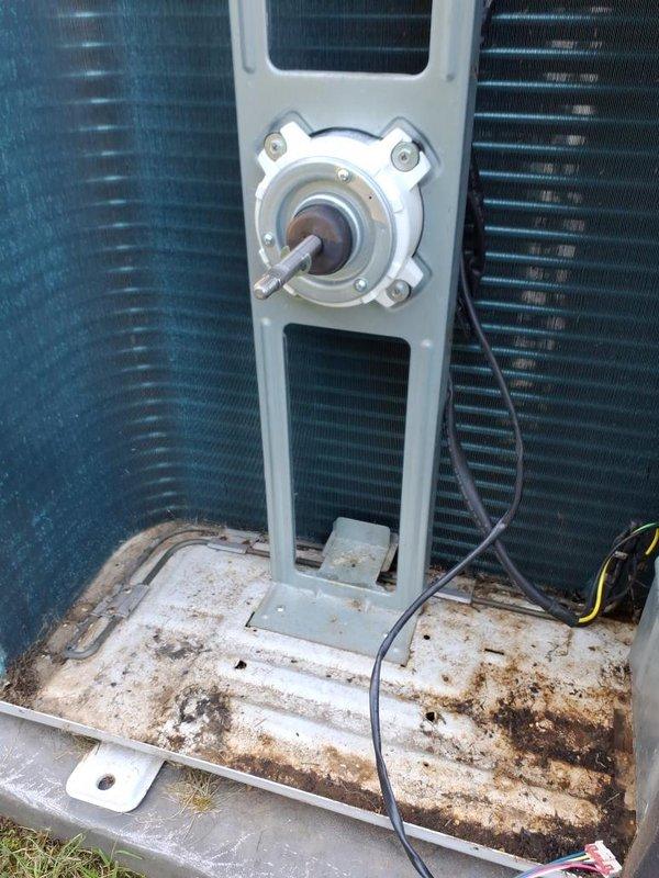 Replaced defective condenser fan motor and main PCB on outdoor HVAC unit. Unit interior showed significant wear with corroded base platform and oxidized refrigerant lines, though these components remained functional. All electrical connections were properly secured with new wiring harnesses, and system was tested to verify proper operation of new components.