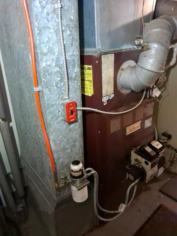Completed gas piping and venting installation for residential heating system. Installed new gas supply lines with proper shut-off valves, connected furnace unit with code-compliant black iron piping, and configured venting system using gray metal ductwork with appropriate elbow fittings to ensure safe exhaust of combustion gases. All connections were pressure tested and verified for proper operation.