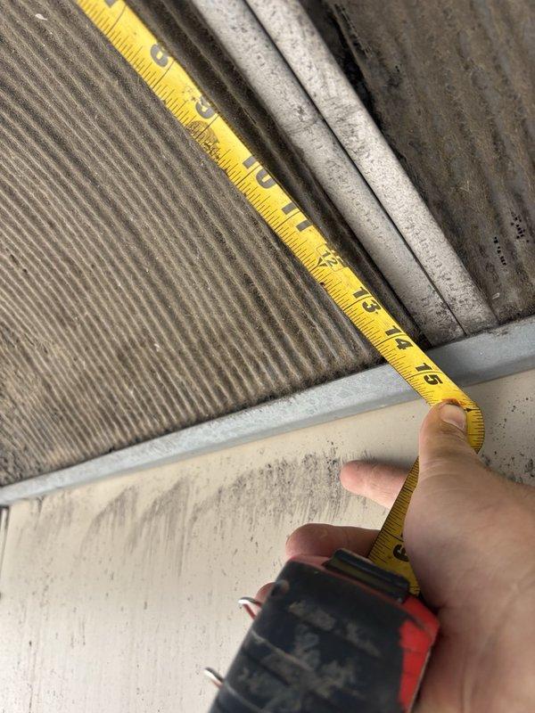 Performed routine maintenance and inspection on five rooftop units. Measured economizer filters for replacement estimate and documented existing filter sizes: (6) 24x24x2, (5) 18x24x2, (2) 14x25x1, and (4) 15x20x1. Accessed rooftop equipment, inspected evaporator coils showing dust accumulation, and photographed equipment components and identification labels for service records.