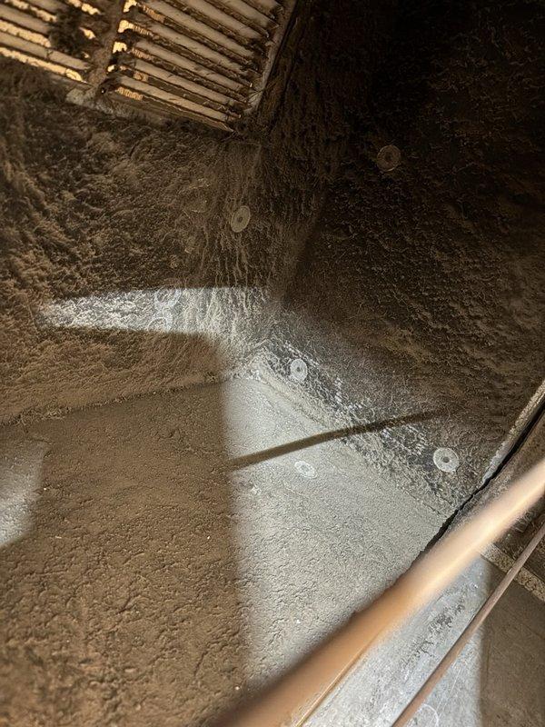 Performed a maintenance inspection and tune-up on one gas furnace, including inspection of the internal ductwork and plenum, which showed heavy dust accumulation and deteriorated areas of the fibrous duct lining. Measured system temperatures with a digital true-RMS meter and temperature probe to verify operating performance, and found no visible frost, rust, or cracking on the equipment or surrounding surfaces.
