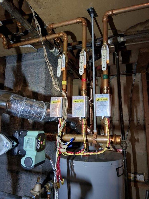 Performed annual gas heating maintenance on the boiler, removing the front panel to inspect the burner assembly, gas valve, control board wiring, and pressure/temperature gauge, with no signs of corrosion, leaks, or damage observed. Verified the hydronic zone valve actuators, circulator pump, and associated copper piping and manifold were in good condition and operating properly.