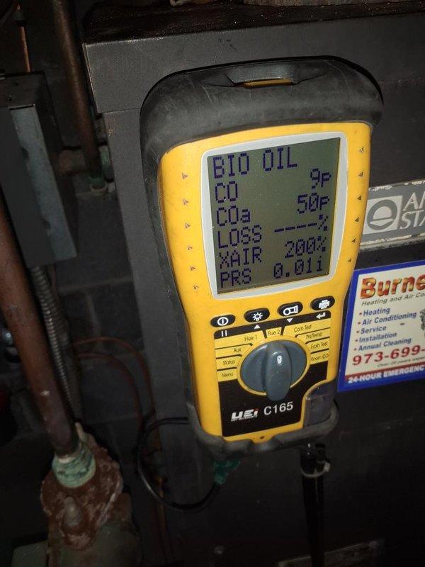 Performed annual maintenance on the oil-fired boiler, including a combustion efficiency test with a handheld analyzer while firing biodiesel-blend fuel; flue gas readings showed CO at 9 ppm with draft at 0.01 in. w.c. Inspected the system and noted significant rust and corrosion on the circulator pump flange, studs, and pump body, along with verdigris on the adjacent threaded fitting and corrosion on nearby piping. Recommend monitoring these areas for leaks and planning repair or replacement of the circulator pump flange assembly.