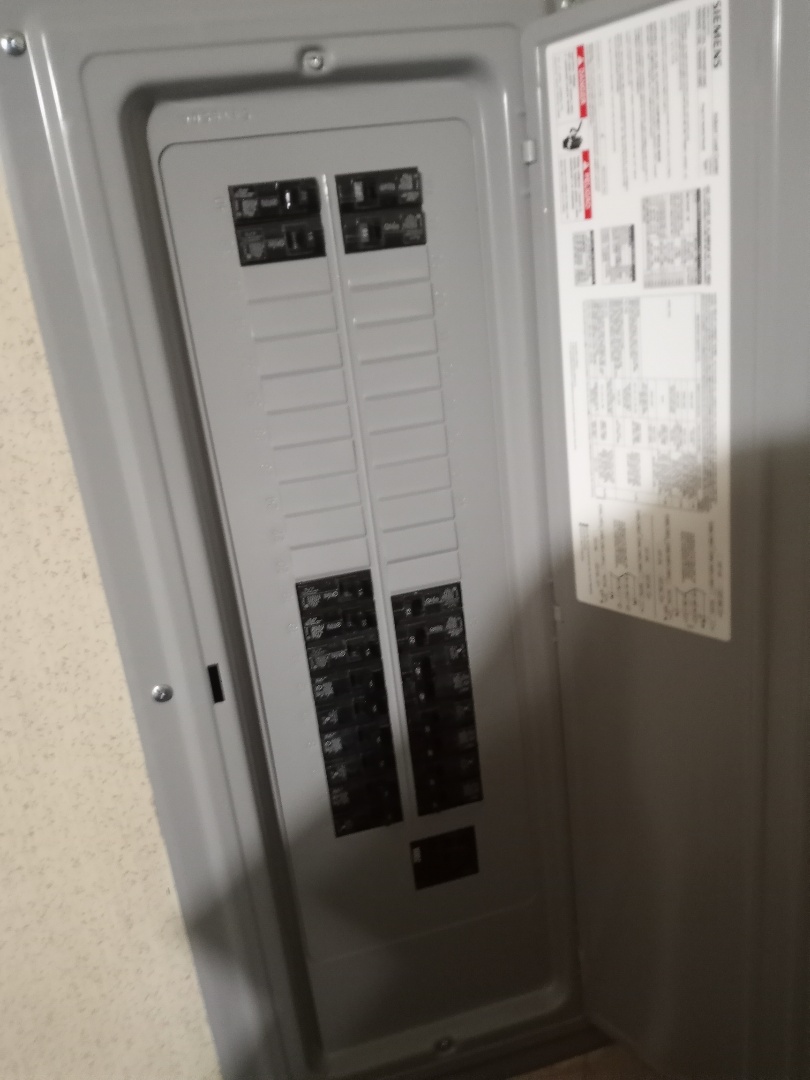 Electrician replacing electrical panel