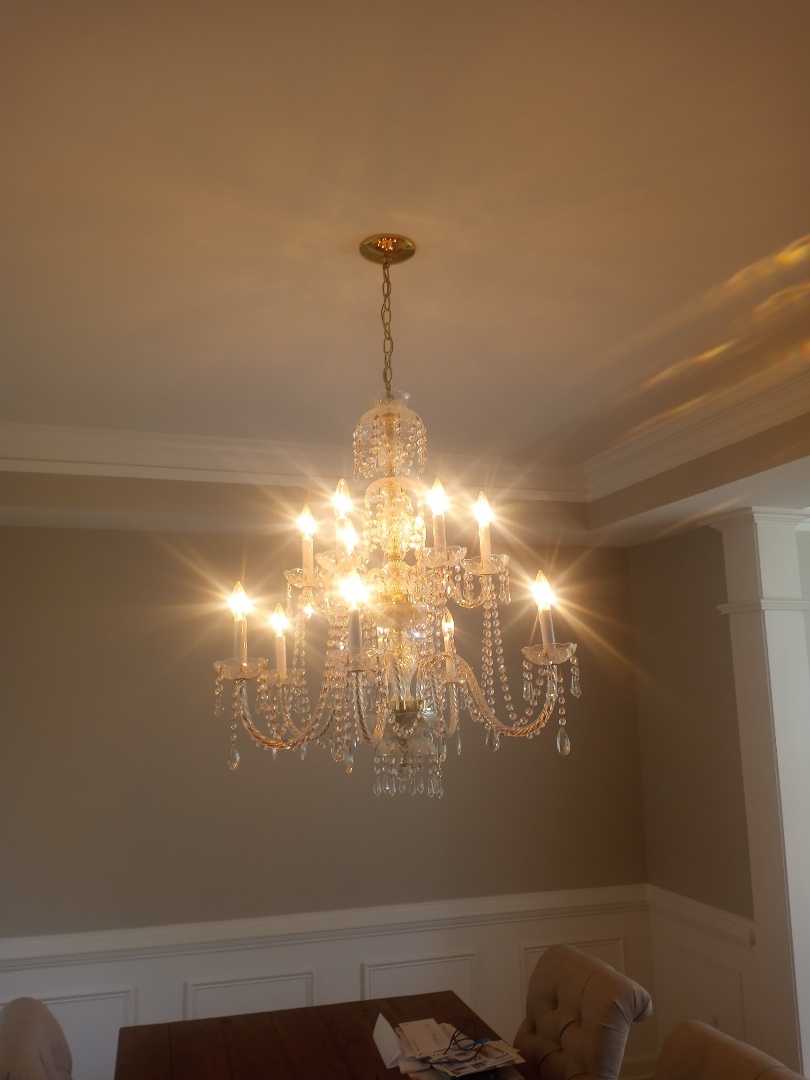 Electrician giving free electrical estimate for Chandelier replacement