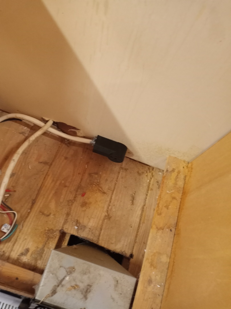 Electrician installing range outlet