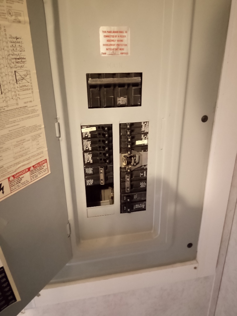 Electrician is doing a panel inspection 